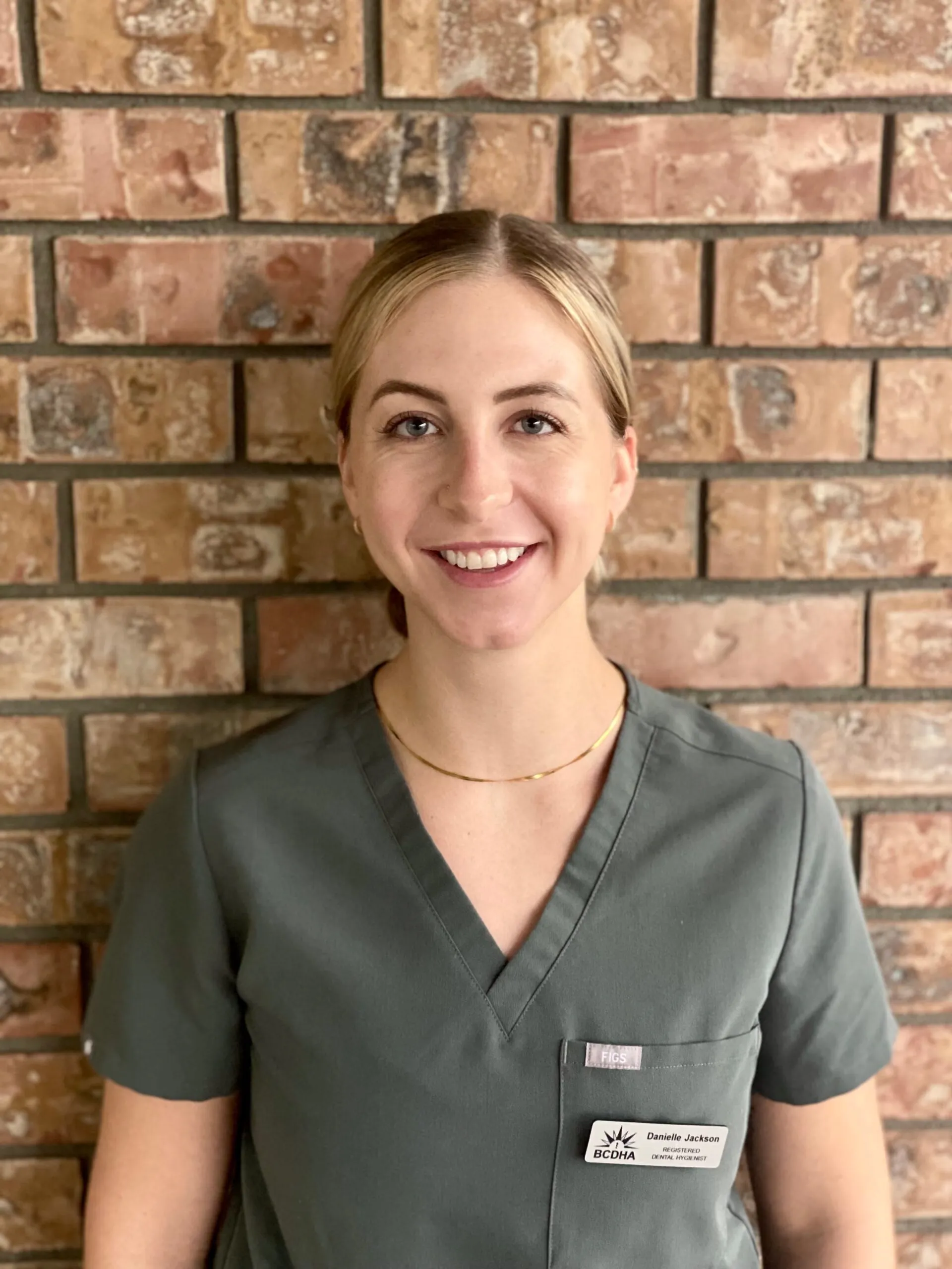 A hygienist on the Abby Dental Care team