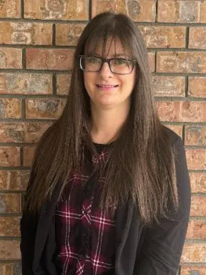 A receptionist on the Abby Dental Care team