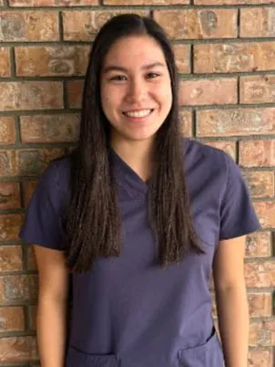 A dental assistant on the Abby Dental Care team