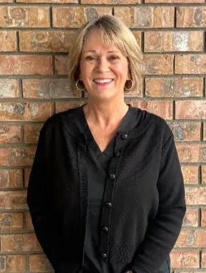 A receptionist on the Abby Dental Care team
